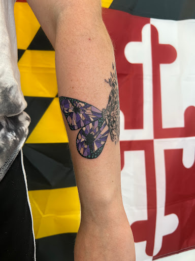 Explore purple flower tattoo ideas, creative tattoo ideas in Leola, available at Sweet Omens