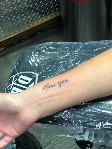 Find in between breast tattoo ideas for your next unique tattoo in Bridgeport at Breaking skin tattoo and body piercing