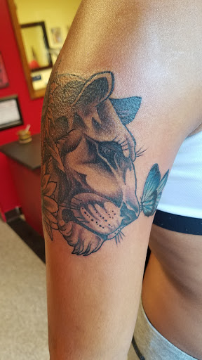 Explore sweet pea tattoo ideas, creative tattoo ideas in Peoria, available at Guerrilla Ink Tattoos