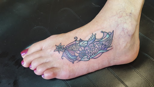 Explore thigh tattoo ideas, creative tattoo ideas in Traverse City, available at Pinups & Needles