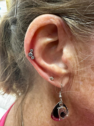 Find rib tattoo ideas for females for your next unique tattoo in Summerfield at Diamond Tattoos & Body Piercings