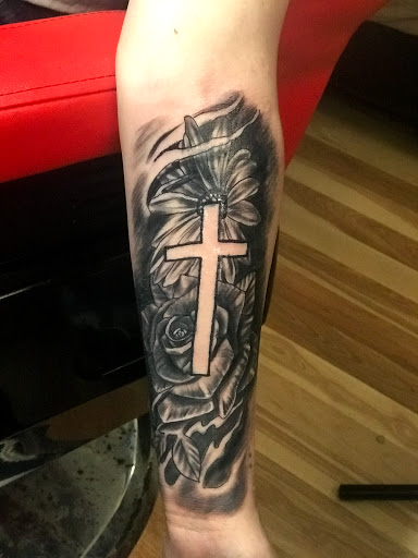 Explore roman numerals tattoo ideas, creative tattoo ideas in Baytown, available at Big Juniors Tattoos