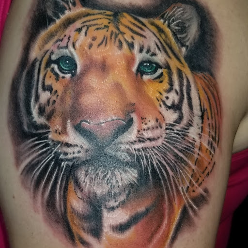 Explore birthday tattoo ideas for men, creative tattoo ideas in Angola, available at Hoodlum Ink