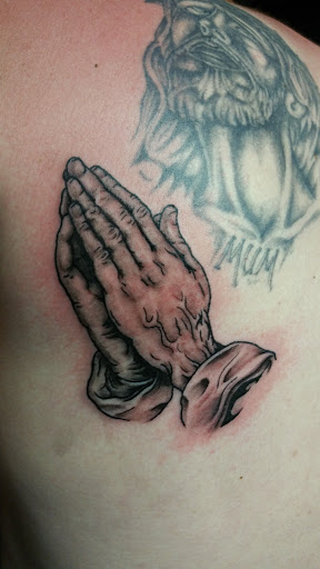 Explore broken glass tattoo ideas, creative tattoo ideas in Foley, available at Black Sheep Custom Tattoos and Piercings