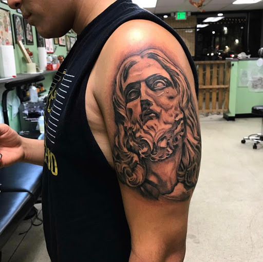 Explore parrot tattoo ideas, creative tattoo ideas in Wilmington, available at Lost Harbor Tattoo