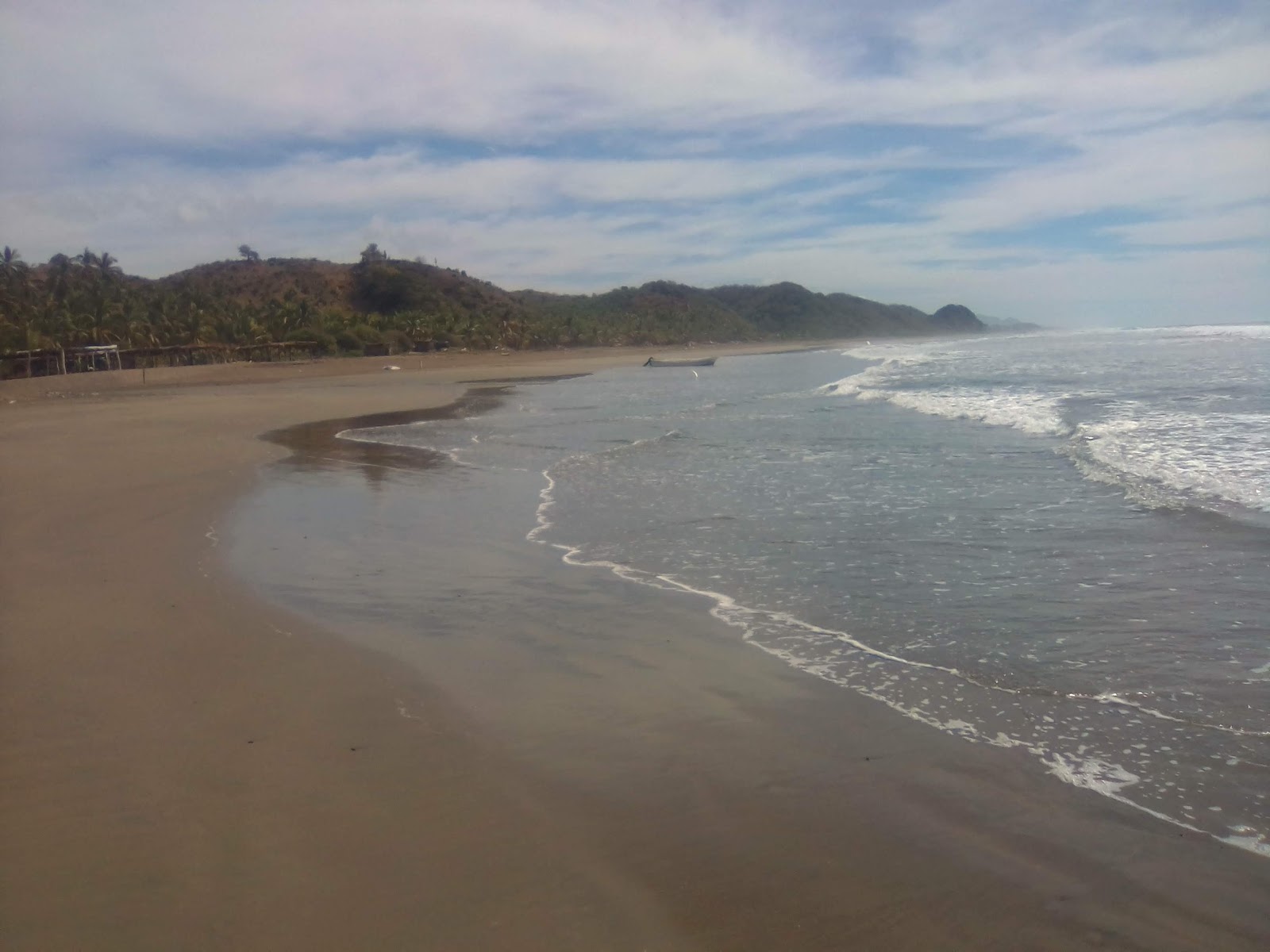 Zdjęcie Playa La Manzanilla II z powierzchnią brązowy piasek