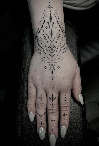 Find between the boob tattoo ideas for your next unique tattoo in Spokane at Anchored Art Tattoo