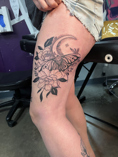Explore sunflower thigh tattoo ideas, creative tattoo ideas in Greenville, available at Empire Ink LLC