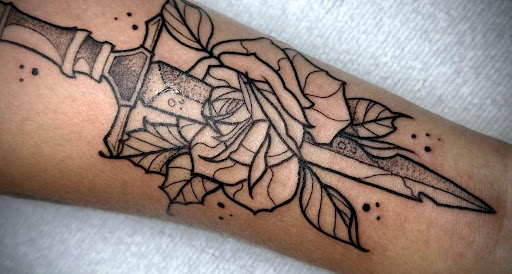 Explore dog bone tattoo ideas, creative tattoo ideas in Tannersville, available at Sacred Ink Studio