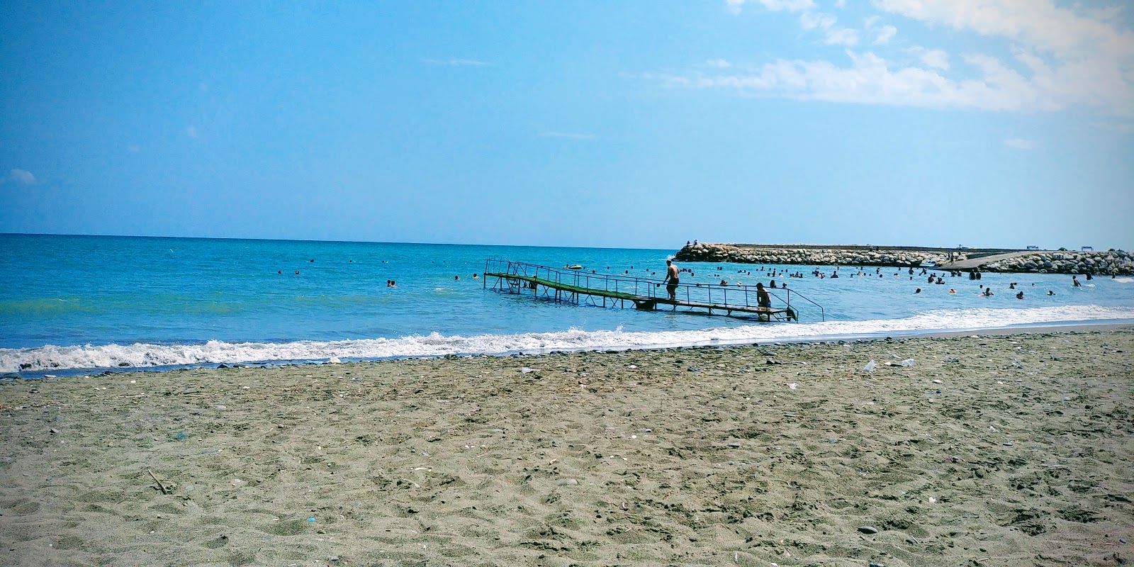 Foto von Arpacbahsis beach und die siedlung