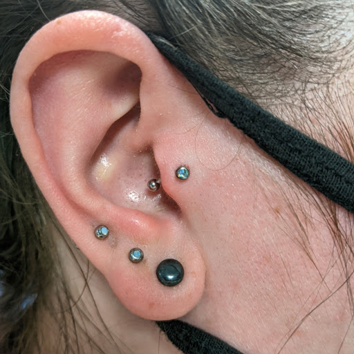 Explore tattoo flag ideas, creative tattoo ideas in Vancouver, available at Studio X Tattoos & Piercings