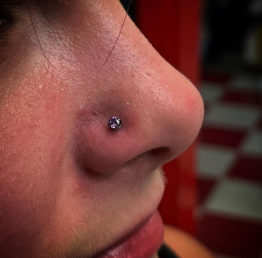 Explore face tattoo ideas black male, creative tattoo ideas in Millsboro, available at Tattoo Galaxy (Millsboro) Piercing & Custom tattoos