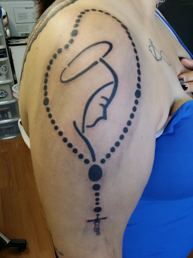 Explore cross tattoo ideas for females, creative tattoo ideas in Wenatchee, available at Rebels Tattoo Studio