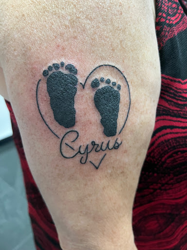 Explore cancer ribbon tattoo ideas, creative tattoo ideas in Norfolk, available at Black Rose & Dagger Tattoo