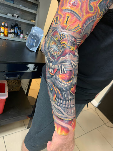 Explore broken glass tattoo ideas, creative tattoo ideas in Sarasota, available at SEVEN SINS Tattoo Studio