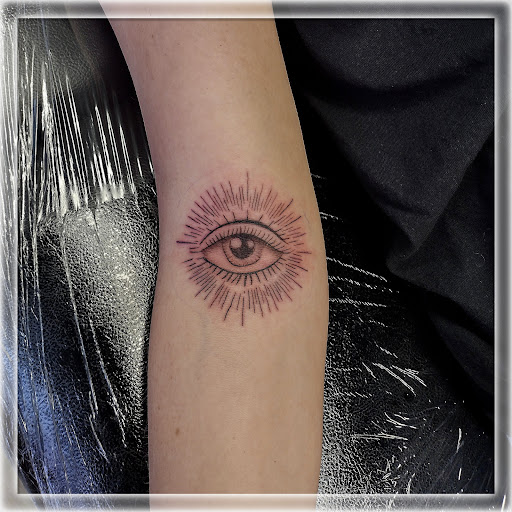 Find lion hand tattoo ideas for men for your next unique tattoo in La Crosse at La Crosse Tattoo