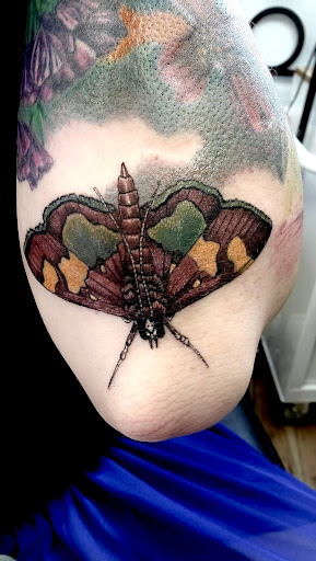 Explore hand tattoo idea, creative tattoo ideas in Groves, available at Billet Tattoo Studio