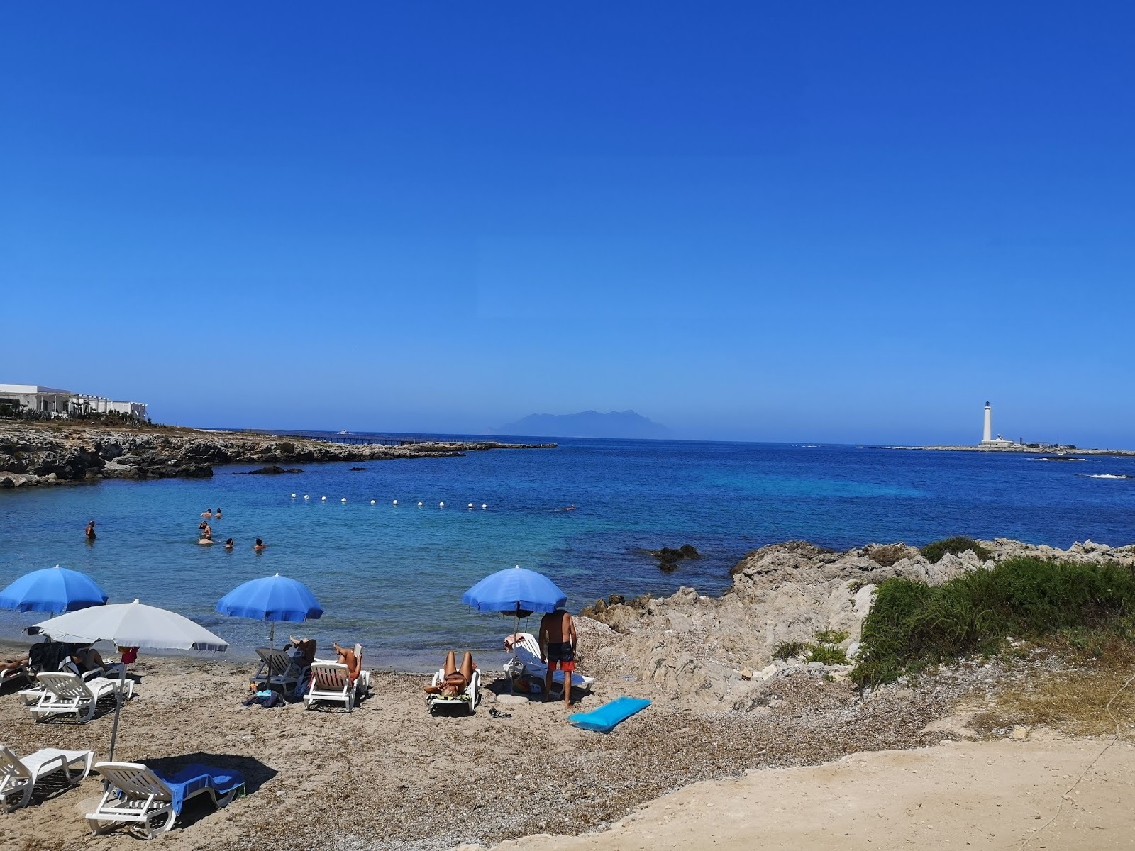 Photo of Cala Grande beach and the settlement