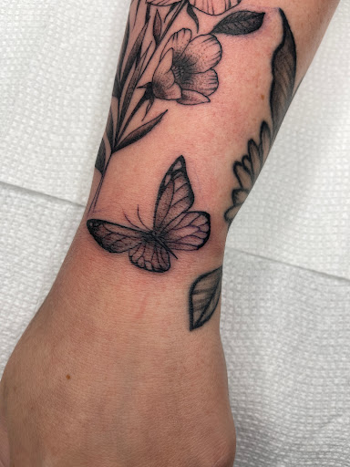 Explore wildflower tattoo ideas, creative tattoo ideas in Atlanta, available at Big Cat Tattoo