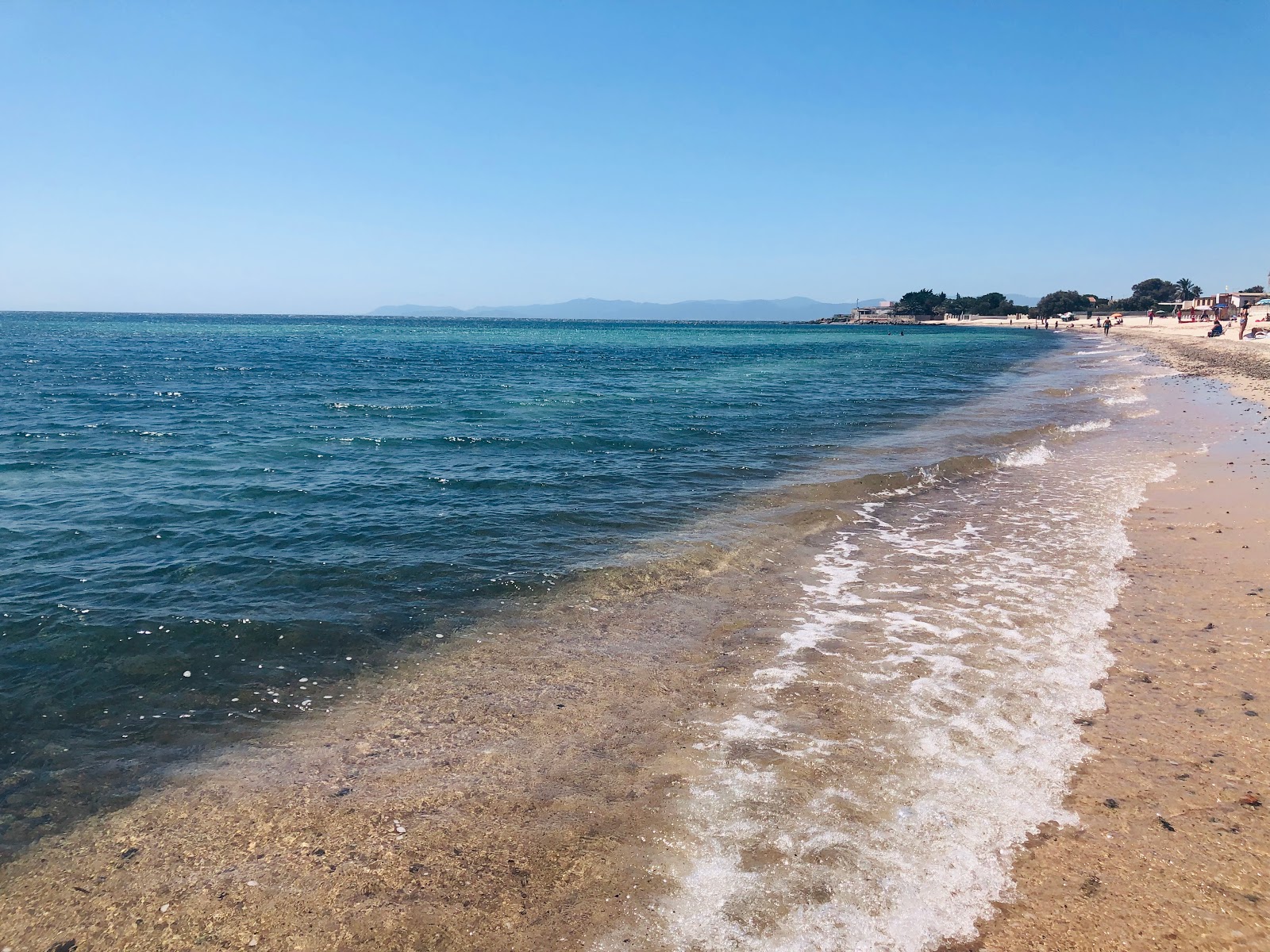 Foto av Spiaggia Di Sant Andrea med rymlig strand