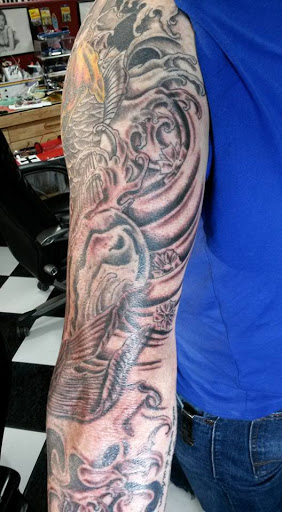 Explore back arm tattoo ideas, creative tattoo ideas in Tucson, available at Tattoo Azteca Inc