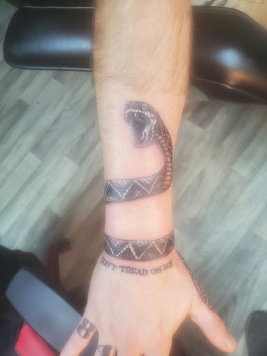 Explore small tattoo ideas for men's arms, creative tattoo ideas in Elyria, available at Raven Ink Tattoo & Piercing