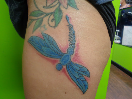 Explore guardian angel tattoo ideas, creative tattoo ideas in Wilmington, available at The Gay Penguin Piercing and Tattoo in Wilmington Nc
