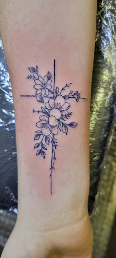 Explore small tattoo ideas for lower back, creative tattoo ideas in Angola, available at Hoodlum Ink