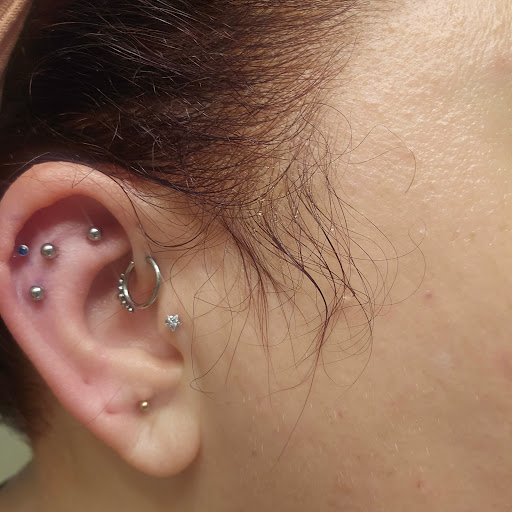 Explore cover up tattoo ideas for females, creative tattoo ideas in Pineville, available at Black Cloud Tattoo and Piercing