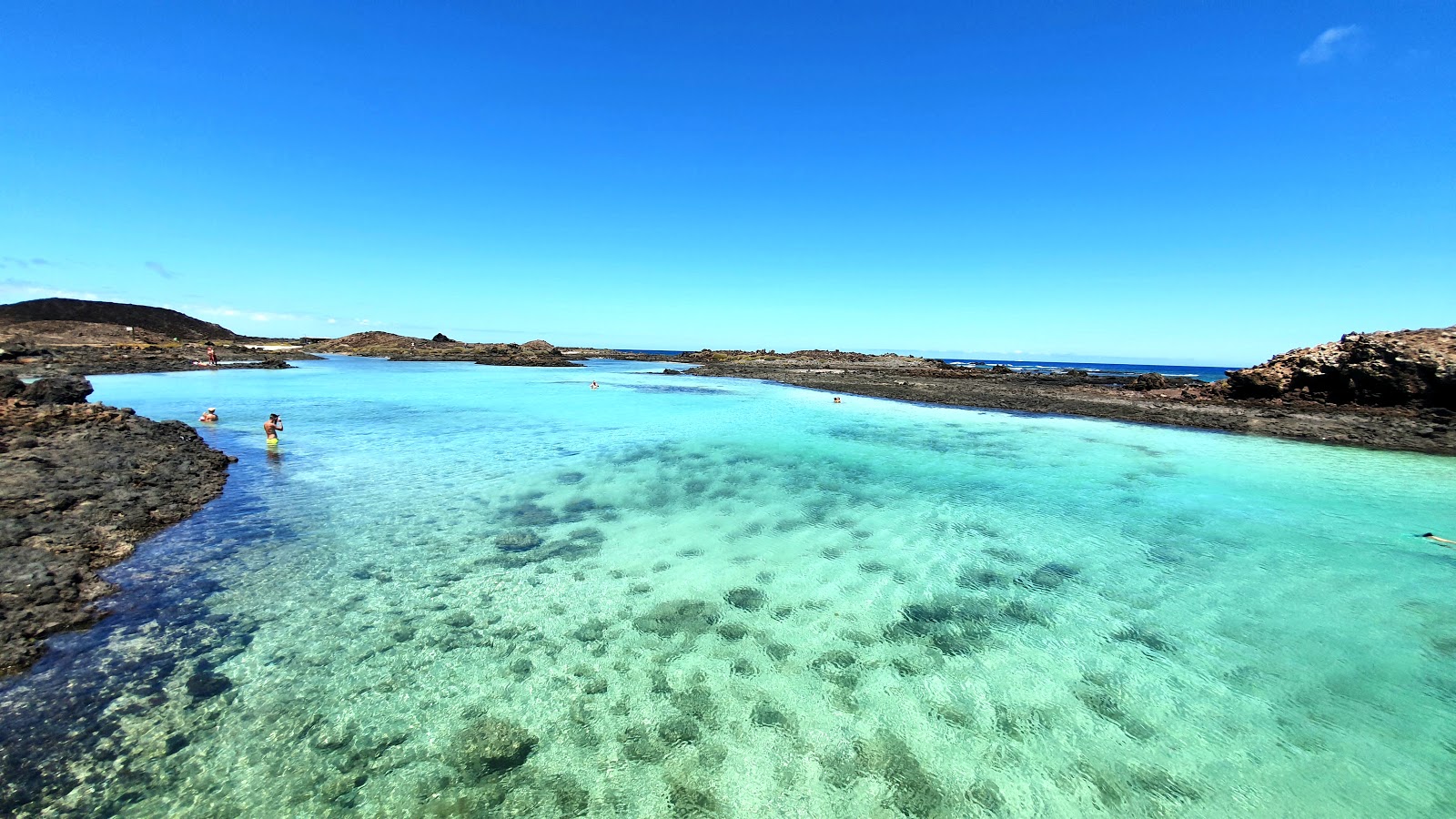 Foto von Puertito Isla De Lobos mit heller sand & felsen Oberfläche