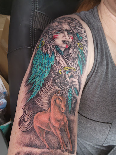 Explore knee tattoo ideas for woman, creative tattoo ideas in Edmond, available at The Tattoo Shop Edmond