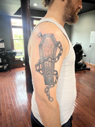 Explore cat and dog tattoo ideas, creative tattoo ideas in Washington, available at Trilogy Atelier - DC Tattoo Shop Piercing Studio