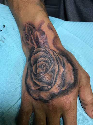 Explore male hand tattoo ideas, creative tattoo ideas in Houston, available at Ink Love Tattoos