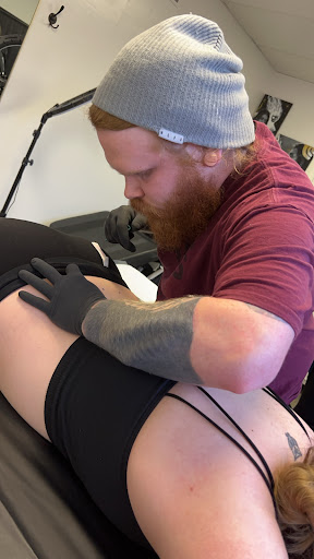 Explore upper back tattoo ideas for guys, creative tattoo ideas in Milwaukee, available at Beauty is Pain Tattoo and Body Piercings