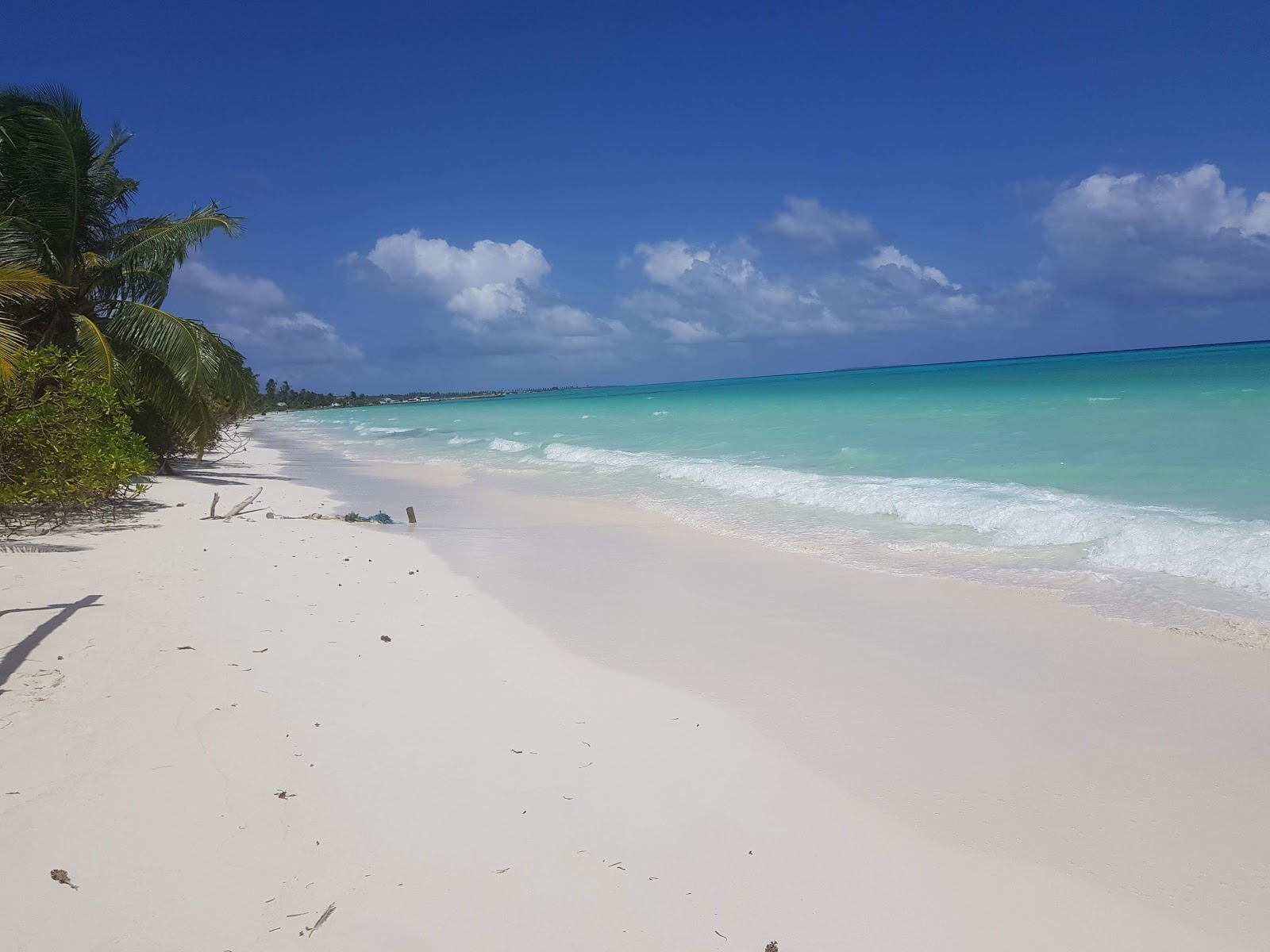 Foto von Mukurimagu Strand mit lange, gerade küste
