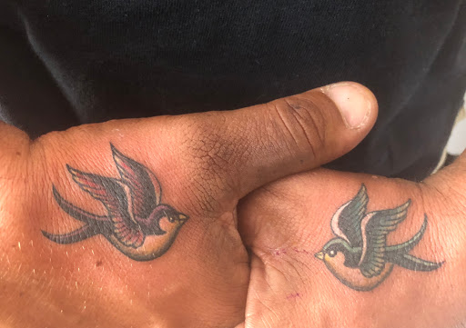 Find tattoo ideas roses for your next unique tattoo in Scarsdale at Damm Nice Tattoo & Body Art