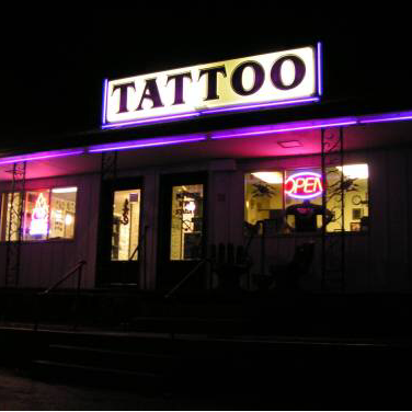 Explore slash tattoo ideas, creative tattoo ideas in Vincennes, available at Altered Image
