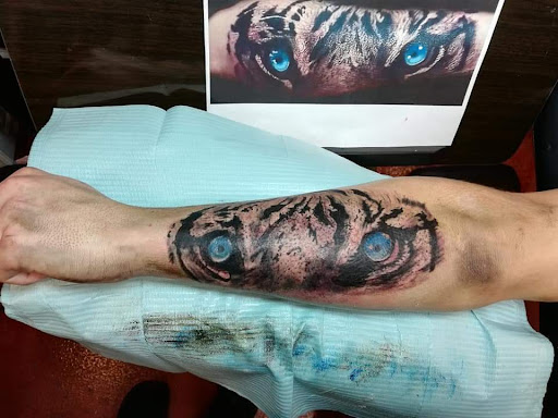 Find is a hand tattoo a bad idea for your next unique tattoo in Dripping Springs at Hill Country Arts Piercings And Tattoos