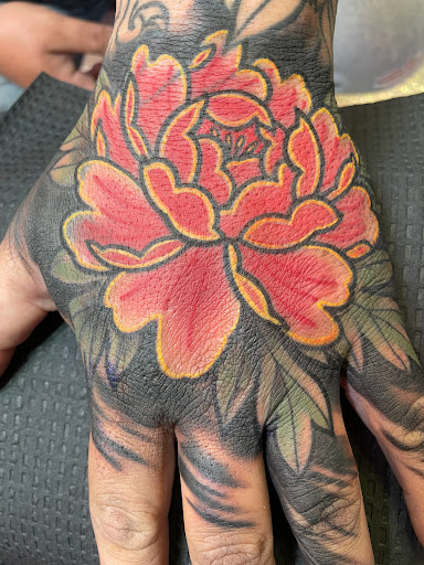 Explore cool elbow tattoo ideas, creative tattoo ideas in Houston, available at The Neon Jackal Tattoo