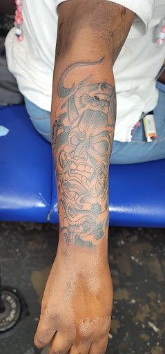 Explore lower arm tattoos ideas for guys, creative tattoo ideas in Jacksonville, available at Renegade Art Studio LLC