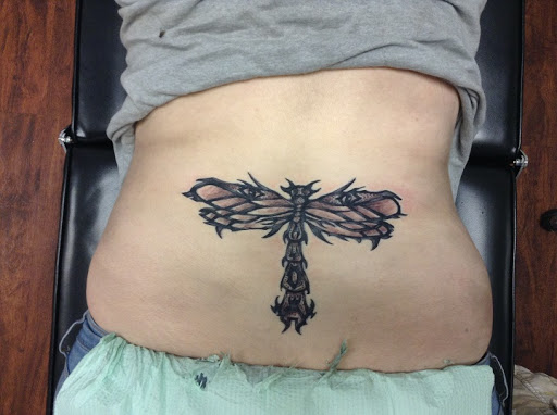 Explore womb tattoo ideas, creative tattoo ideas in Seymour, available at American Gypsy Tattoo Corp.
