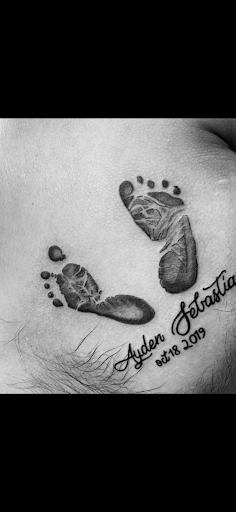 Explore mens foot tattoo ideas, creative tattoo ideas in Rogers, available at Ink Solutions Tattoo