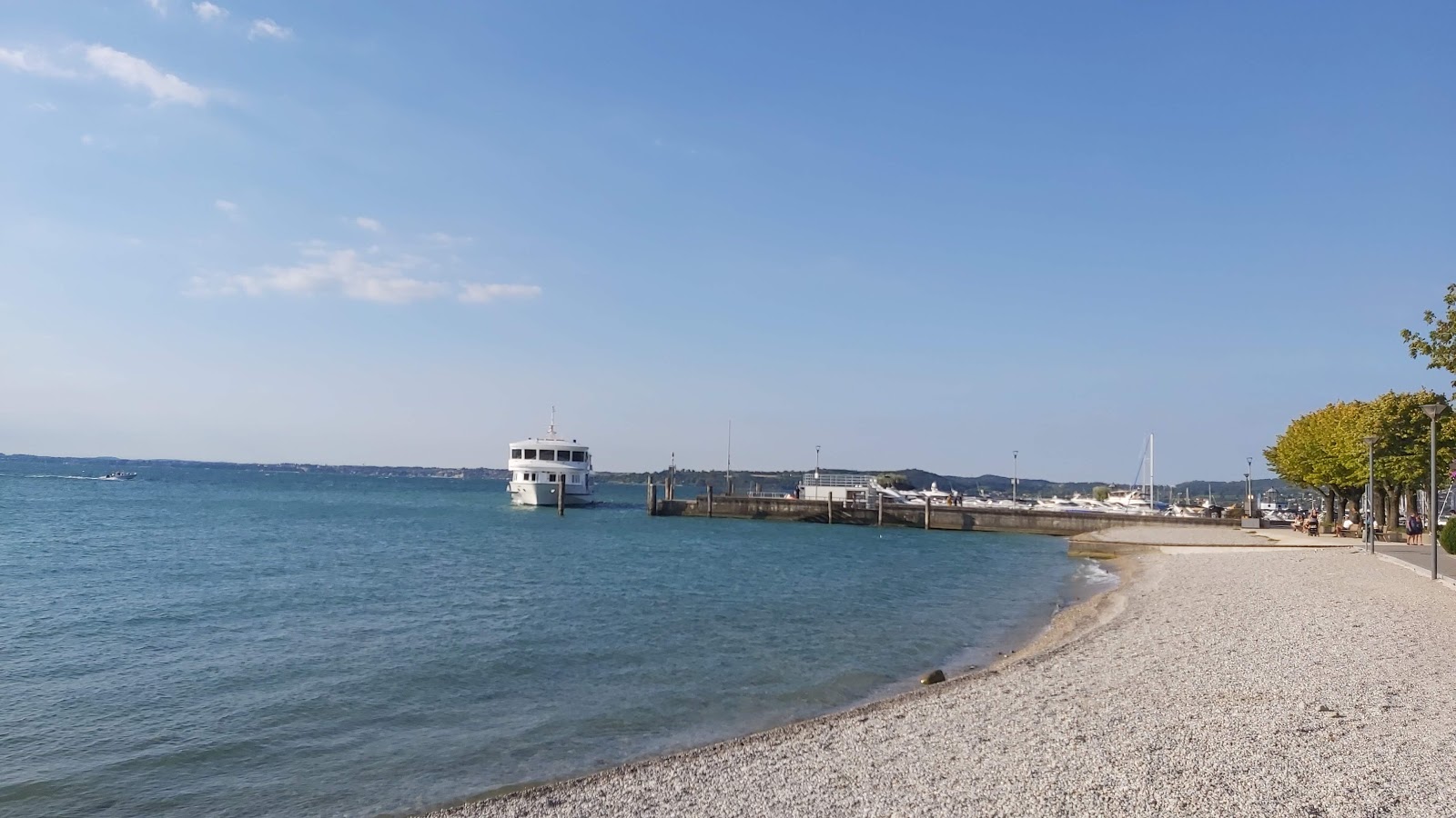 Foto von Spiaggia Porto und die siedlung