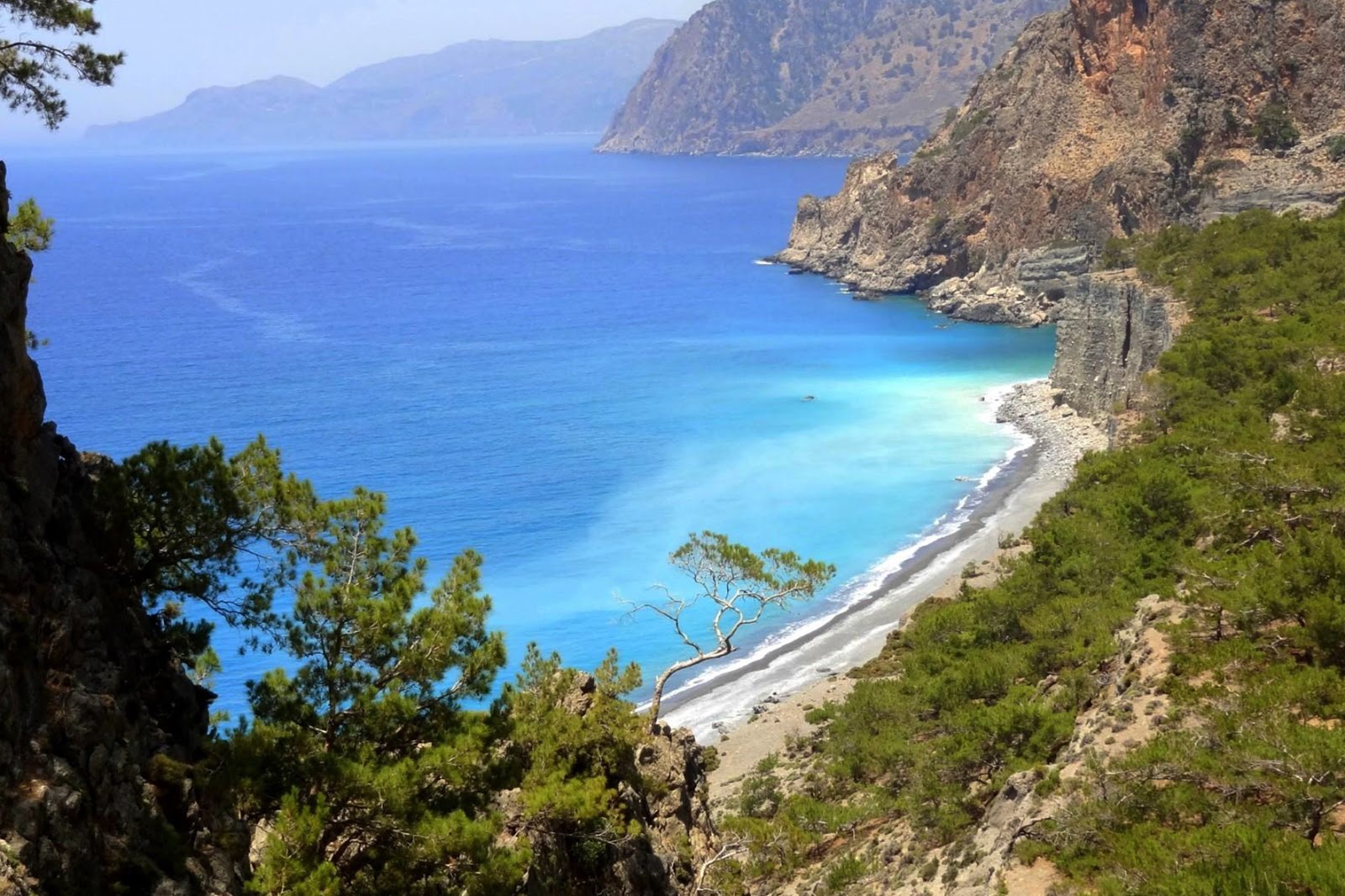 Photo of Domata beach surrounded by mountains