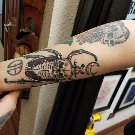 Explore mother and son tattoos ideas, creative tattoo ideas in Lodi, available at Emerald Tattoo & Piercing - Lodi