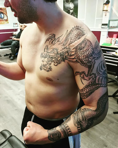 Explore unique tramp stamp tattoo ideas, creative tattoo ideas in Westland, available at Premier Tattoo Company Westland