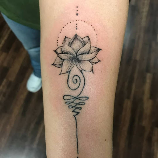 Explore flower ankle tattoo ideas, creative tattoo ideas in Reno, available at Evolution Tattoo