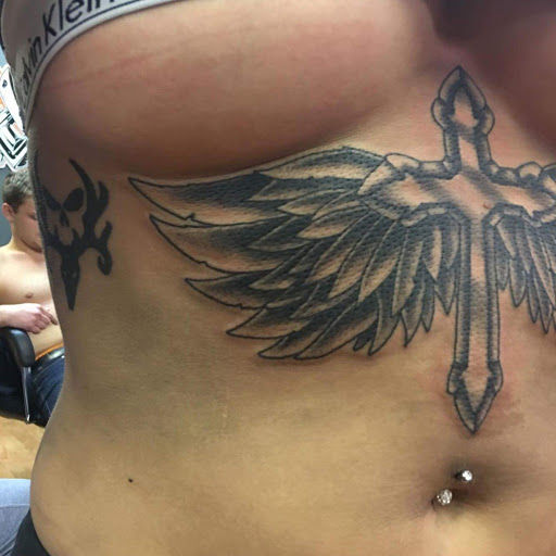 Explore lower back tattoo cover up ideas, creative tattoo ideas in Bridgeport, available at Breaking skin tattoo and body piercing