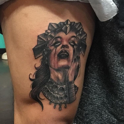 Explore black king tattoo ideas, creative tattoo ideas in San Diego, available at Sideshow Tattoo and Piercing