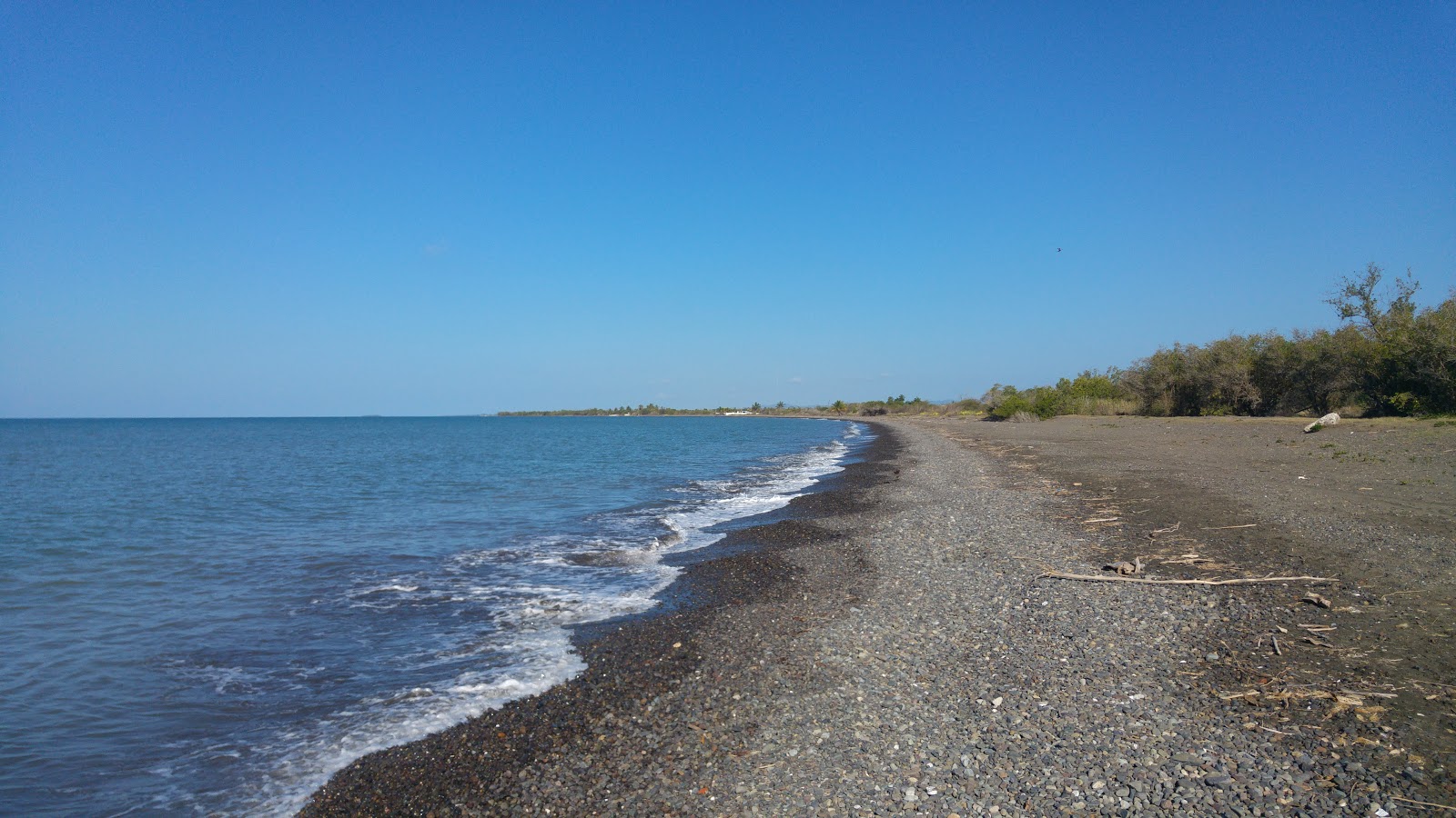 Foto di Playa Bizarreta con una superficie del ciottolo fine grigio